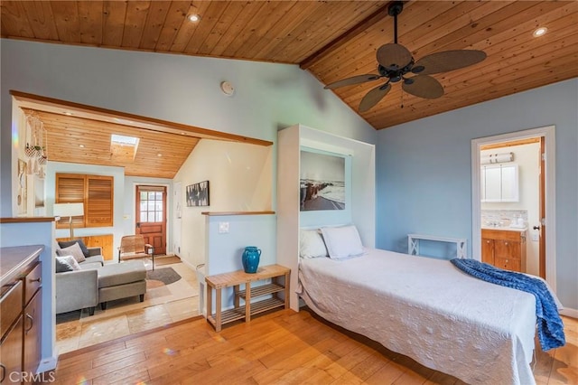 bedroom with light wood-type flooring, wood ceiling, and vaulted ceiling