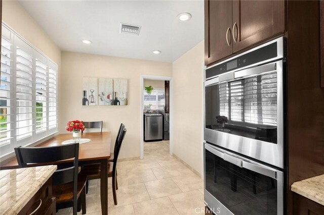 dining room featuring visible vents, baseboards, recessed lighting, light tile patterned flooring, and independent washer and dryer