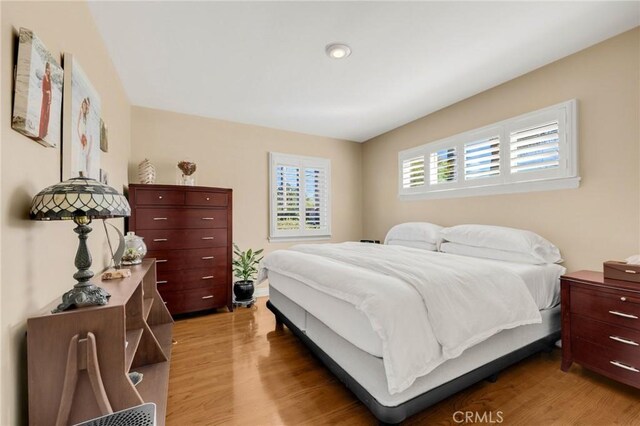 bedroom featuring light wood-style flooring