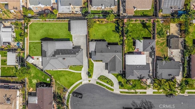 birds eye view of property with a residential view