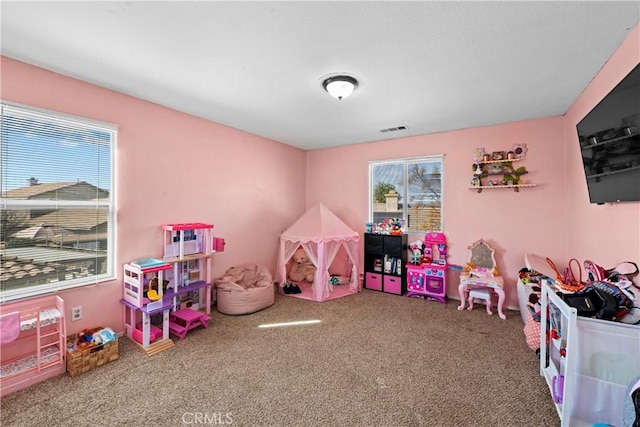 game room with carpet floors and visible vents