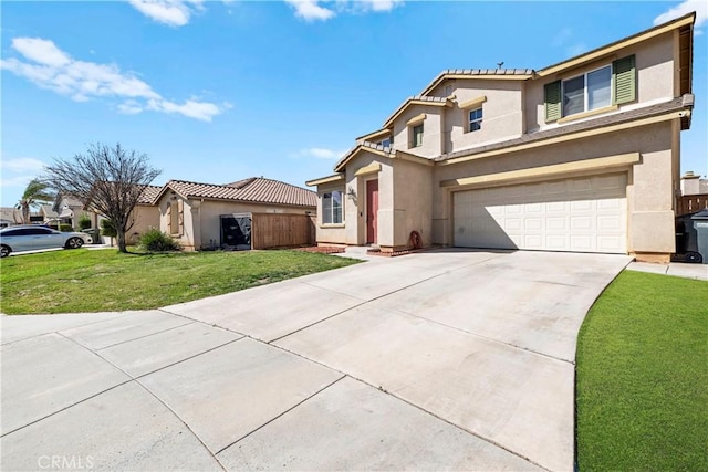 view of front of house with a garage, concrete driveway, a front yard, and stucco siding