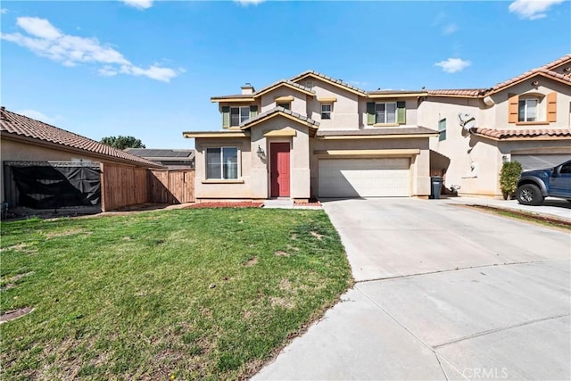 view of front of home with a garage, concrete driveway, stucco siding, fence, and a front yard