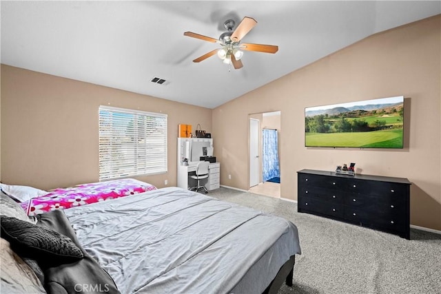 carpeted bedroom featuring vaulted ceiling, ceiling fan, visible vents, and baseboards