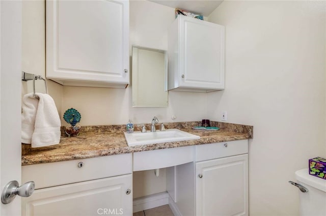 bathroom with toilet and vanity