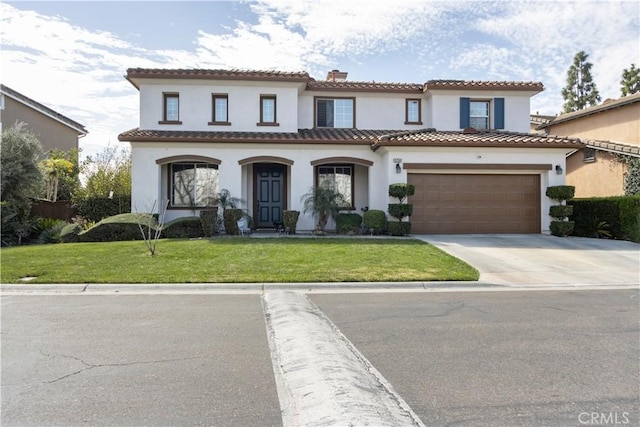 mediterranean / spanish home featuring a garage, a front yard, a tile roof, and stucco siding