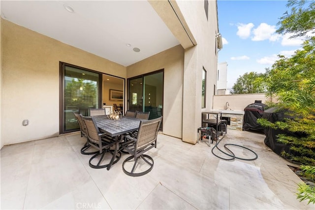 view of patio / terrace featuring a grill and outdoor dining area