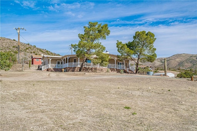 exterior space featuring a mountain view and a porch