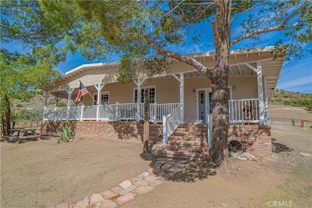 view of front of property featuring covered porch