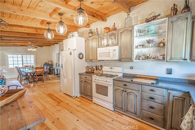 kitchen featuring white appliances, dark countertops, wood ceiling, and light wood-style floors