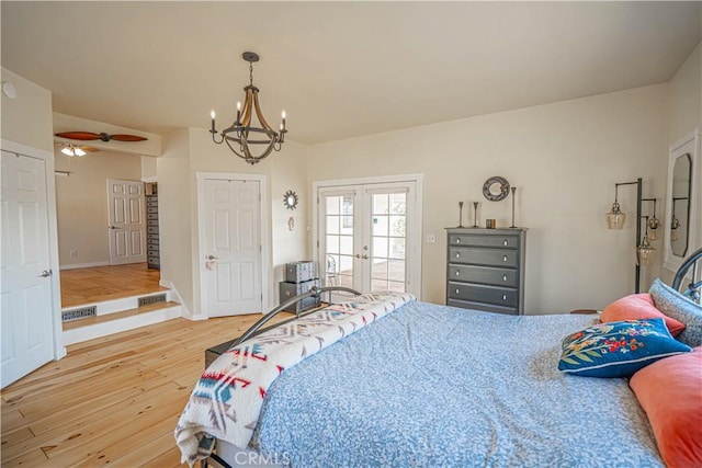 bedroom featuring french doors, access to outside, visible vents, light wood-type flooring, and baseboards