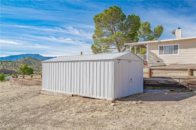 view of shed with a mountain view