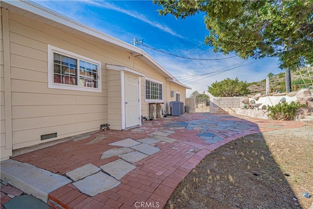 view of patio featuring fence and cooling unit