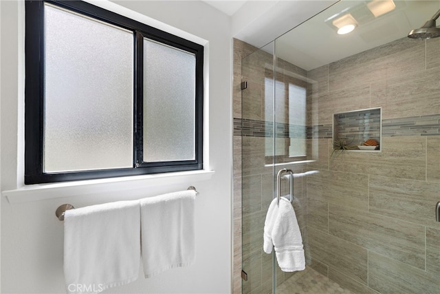 bathroom featuring a shower stall