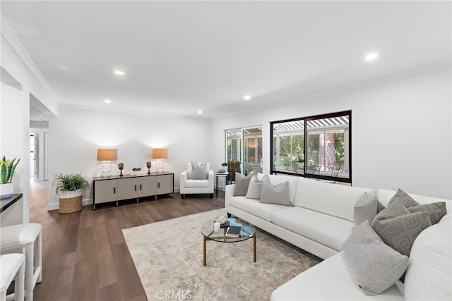 living room with recessed lighting, crown molding, and wood finished floors