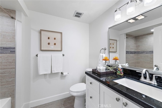 bathroom with baseboards, visible vents, toilet, walk in shower, and vanity