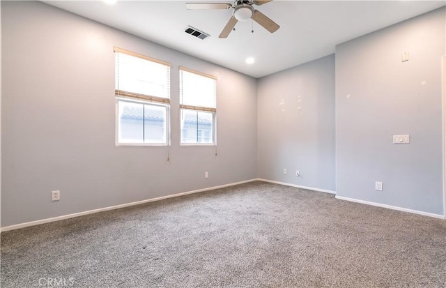 carpeted empty room featuring a ceiling fan, recessed lighting, visible vents, and baseboards