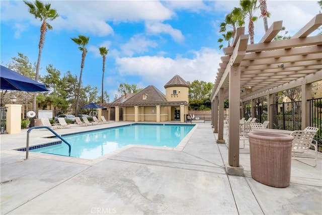 community pool featuring a patio area, fence, and a pergola