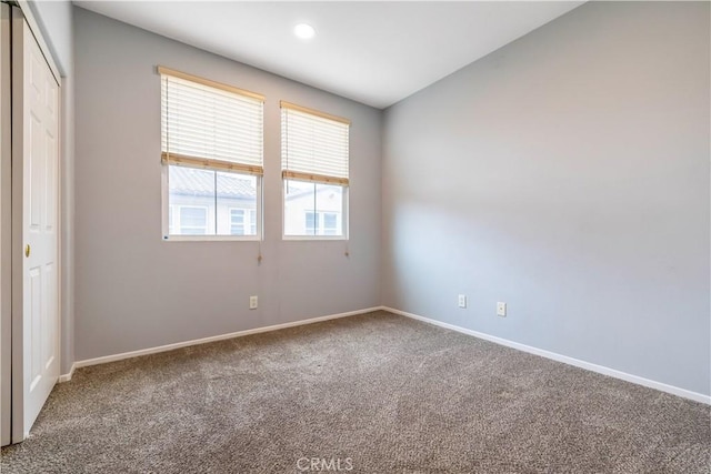 unfurnished room with recessed lighting, carpet flooring, and baseboards