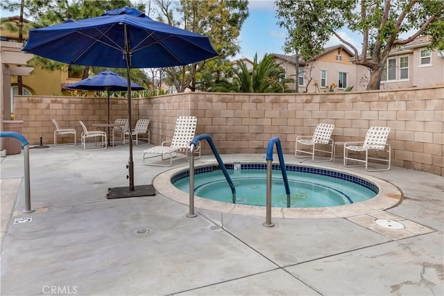 view of pool with fence and a patio