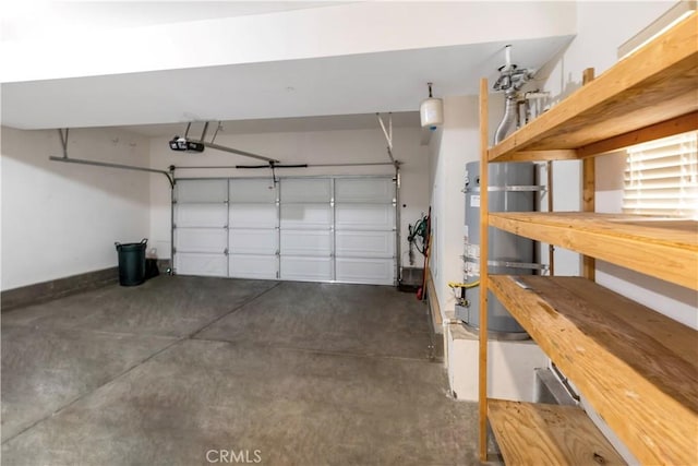 garage featuring water heater, baseboards, and a garage door opener