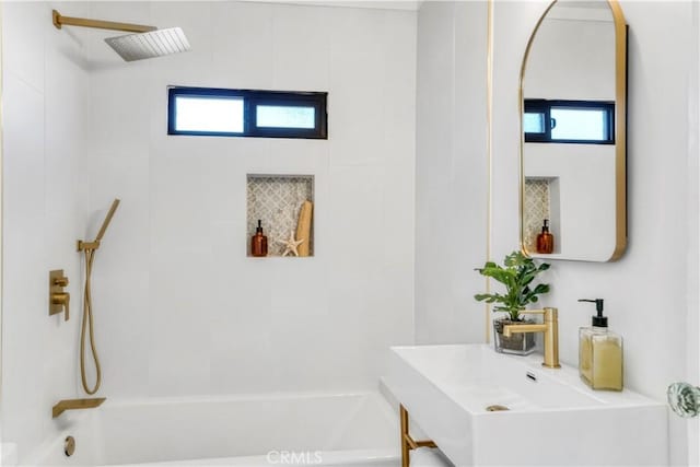 full bath featuring shower / bathing tub combination and a healthy amount of sunlight