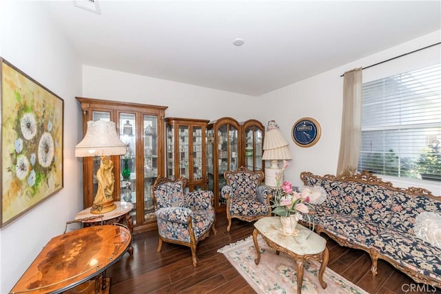 living room with visible vents and wood finished floors