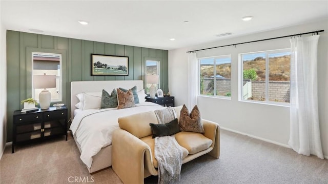 bedroom featuring carpet floors, visible vents, and baseboards