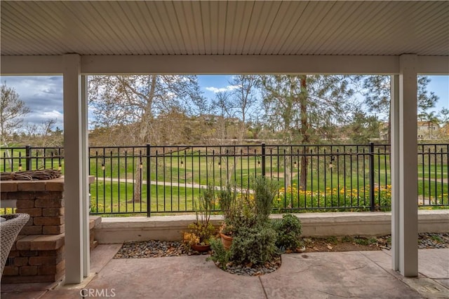 view of patio featuring fence