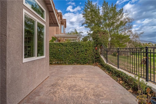 view of patio with fence