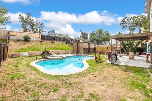 view of pool with a fenced backyard, a pool with connected hot tub, a yard, grilling area, and a patio area