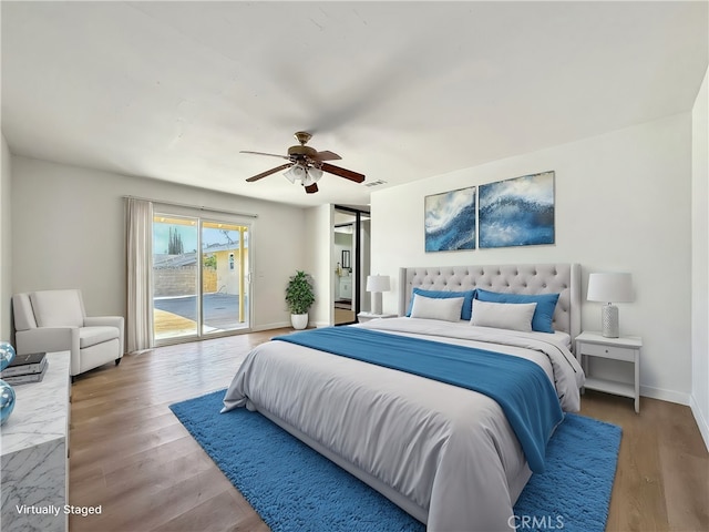 bedroom featuring access to outside, baseboards, ceiling fan, and wood finished floors