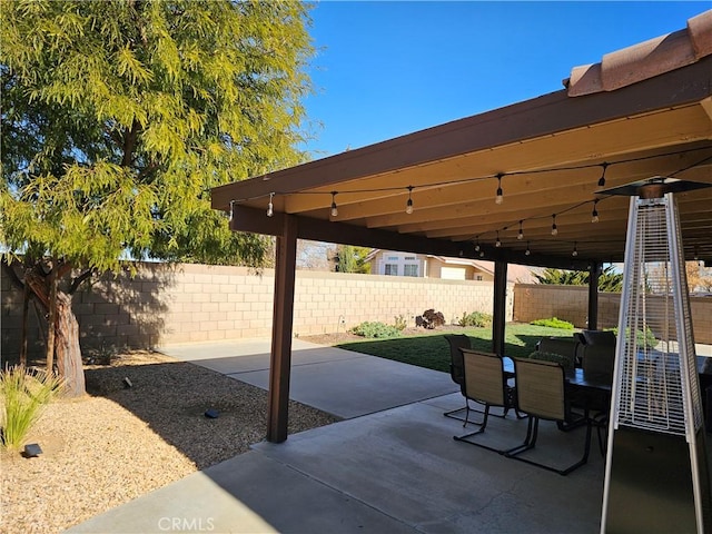 view of patio with outdoor dining area and a fenced backyard