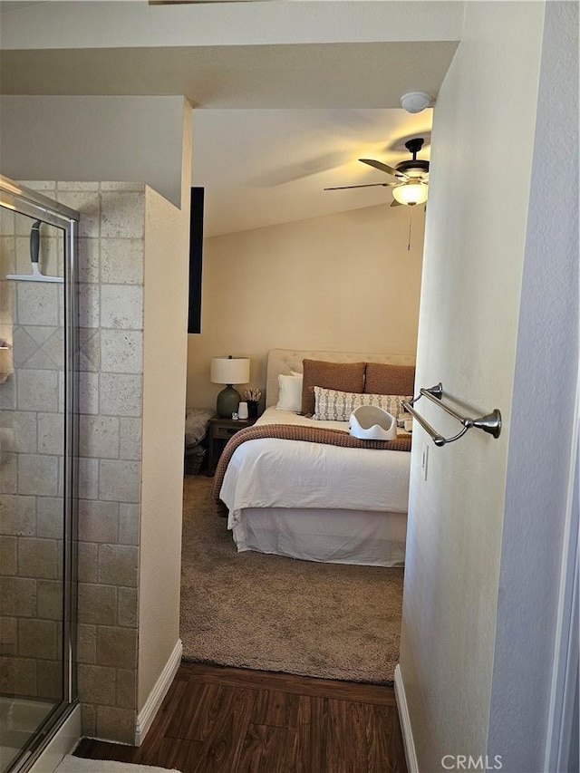 bedroom featuring dark wood-style floors, baseboards, and a ceiling fan