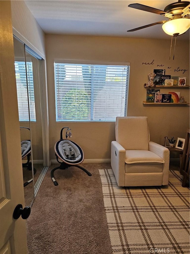 sitting room with carpet, plenty of natural light, baseboards, and ceiling fan