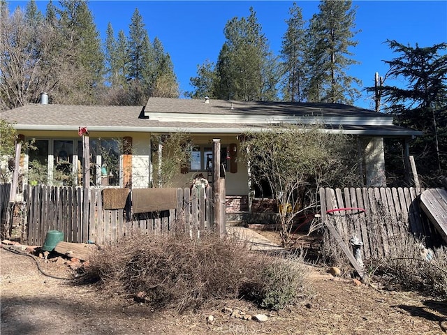 view of front of home with fence