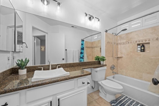 full bath featuring visible vents, toilet, tile patterned floors, shower / bath combo with shower curtain, and vanity