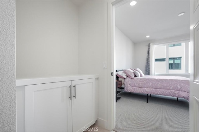 bedroom with carpet floors and recessed lighting