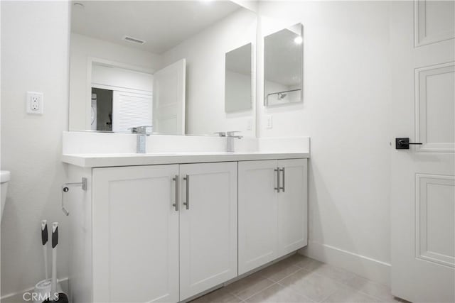 16289 Dawn Way Unit 204, Tustin, CA 92782 - bathroom featuring baseboards, vanity, tile patterned floors, and toilet
