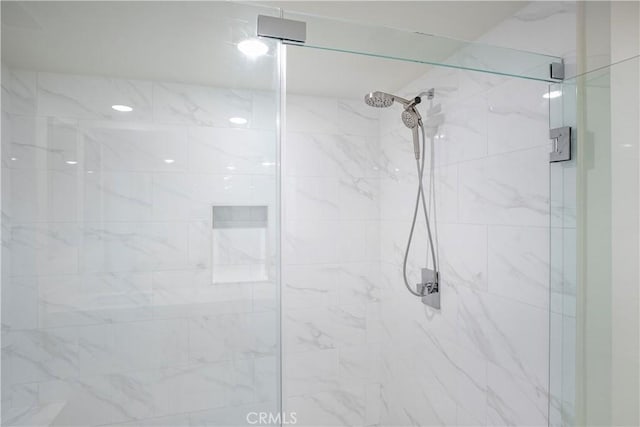 bathroom with a shower stall