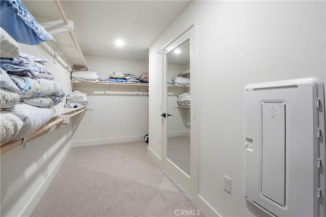 spacious closet featuring carpet floors
