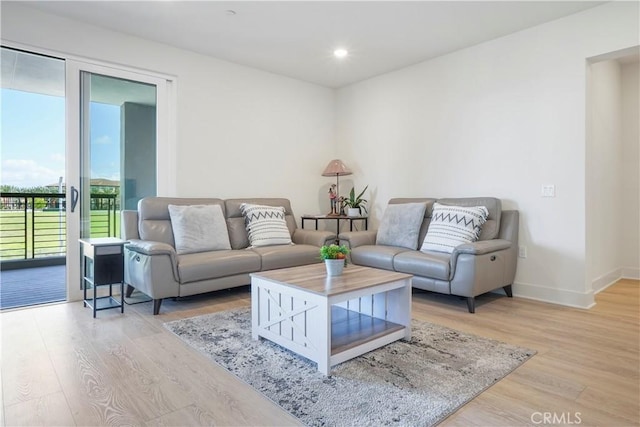 16289 Dawn Way Unit 204, Tustin, CA 92782 - living room featuring light wood-style flooring, baseboards, and recessed lighting