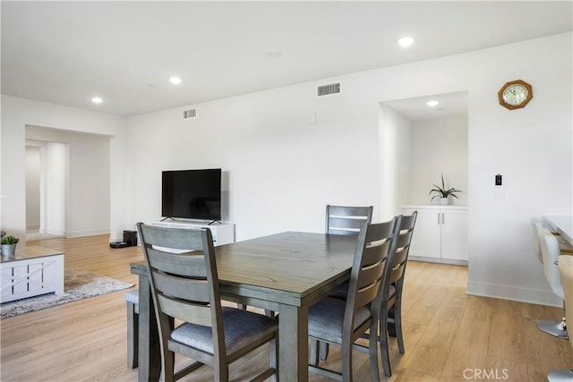 dining area with recessed lighting, light wood finished floors, and visible vents