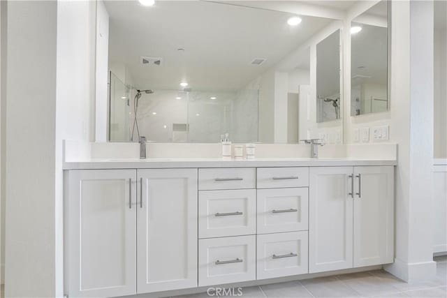 16289 Dawn Way Unit 204, Tustin, CA 92782 - bathroom with a marble finish shower, double vanity, tile patterned flooring, recessed lighting, and baseboards