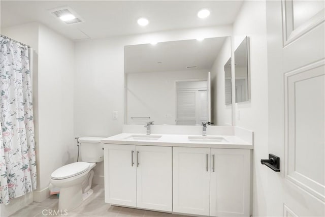 16289 Dawn Way Unit 204, Tustin, CA 92782 - full bathroom with toilet, double vanity, recessed lighting, tile patterned flooring, and a shower with shower curtain