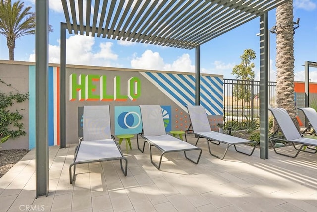 view of patio / terrace with fence and a pergola