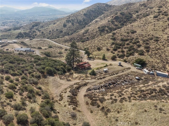 birds eye view of property featuring a mountain view