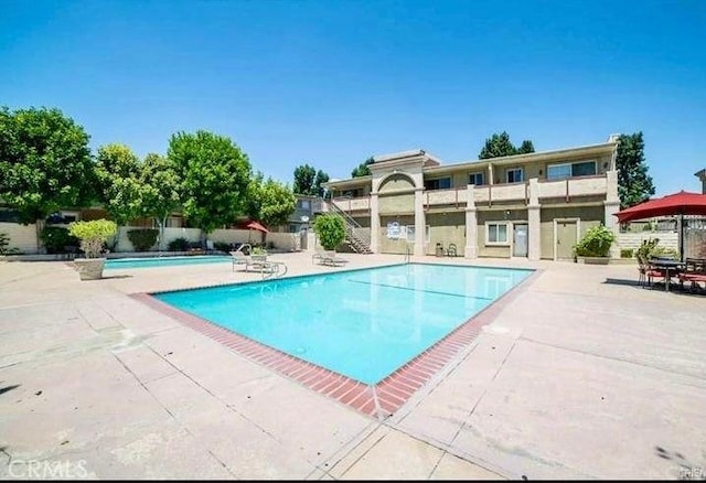 20146 Cohasset St Unit 15, Winnetka, CA 91306 - community pool with a patio area and fence