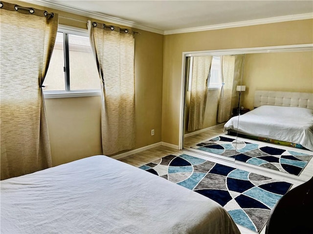 20146 Cohasset St Unit 15, Winnetka, CA 91306 - bedroom with wood finished floors, multiple windows, crown molding, and baseboards