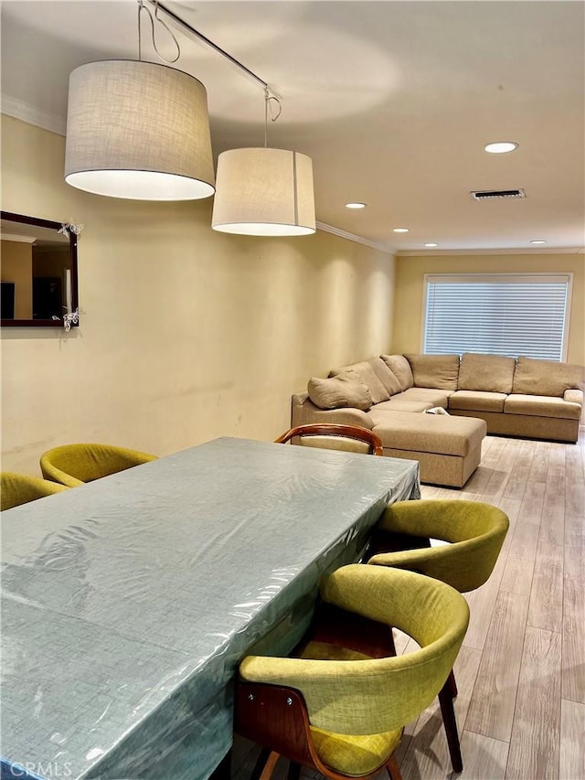 20146 Cohasset St Unit 15, Winnetka, CA 91306 - dining area with crown molding, hardwood / wood-style floors, and recessed lighting